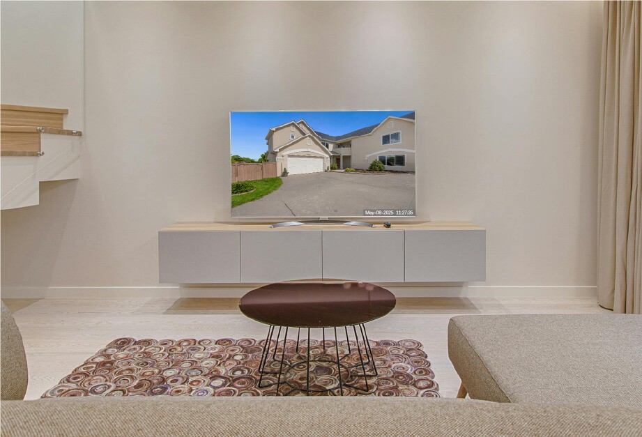 security camera live view displayed on a TV in a home living room